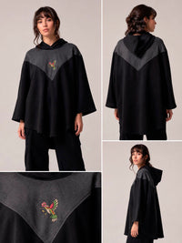 Poncho negro con colibrí bordado